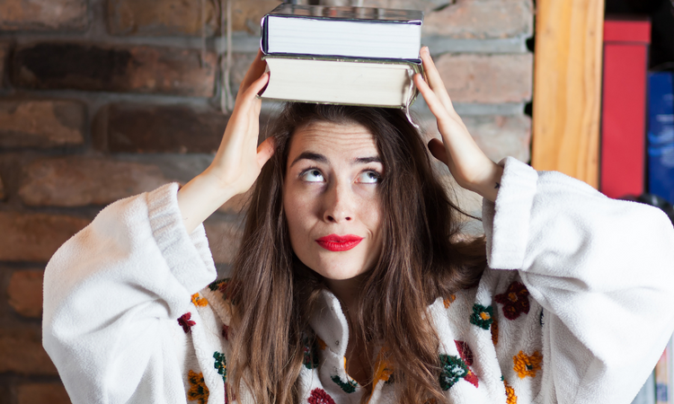 accountant with books on her head